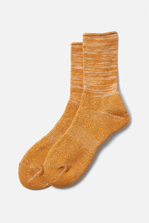 The RoToTo Washi Pile Crew Socks in dark yellow feature a ribbed upper and traditional Japanese paper yarn style, shown on a plain white background.