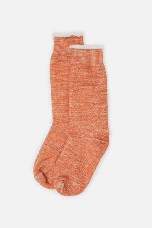 The RoToTo Double Face Crew Socks in orange, by RoToTo, are soft Japanese-made crew socks with ribbed cuffs, shown laid flat on a white background.