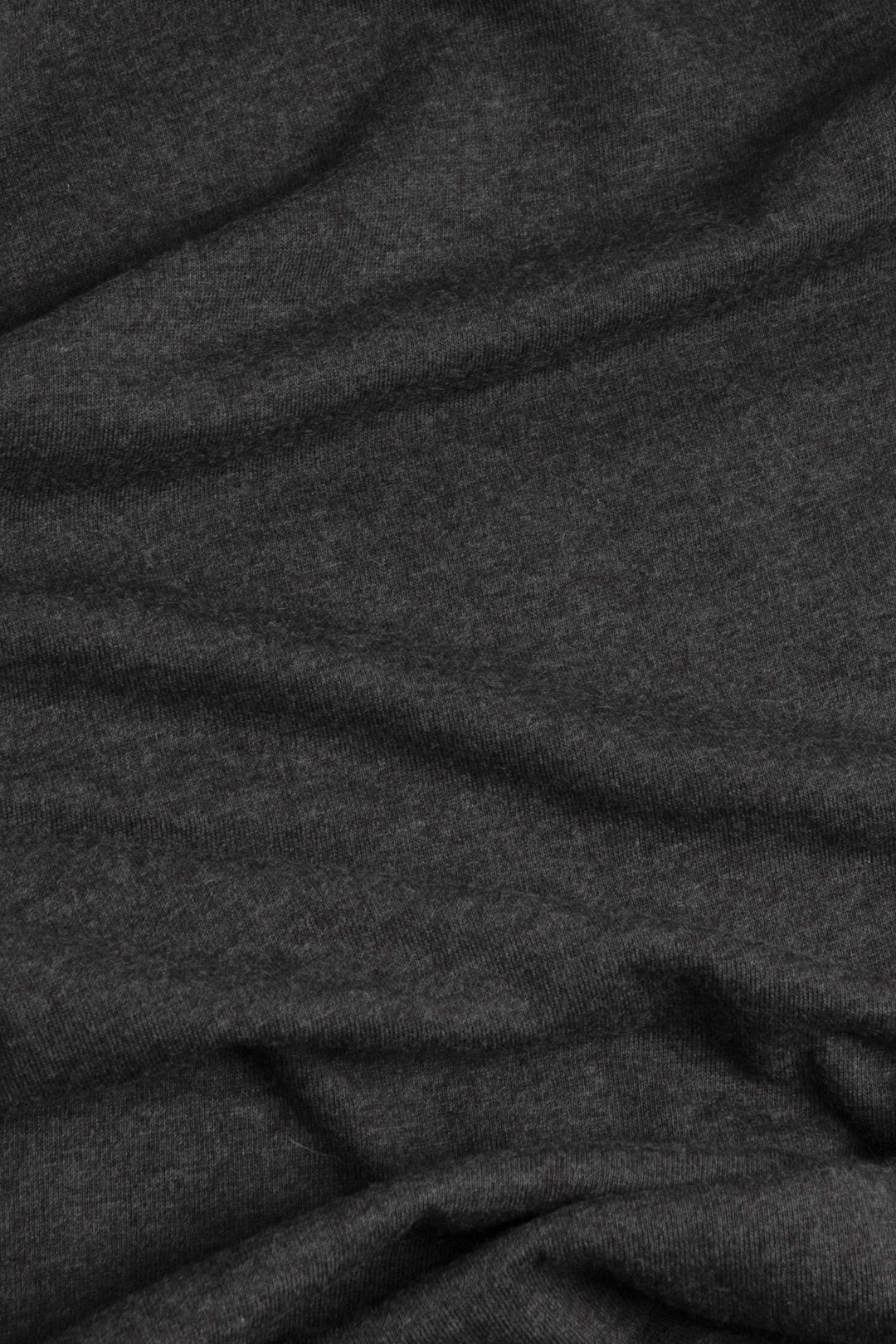 A close-up of the charcoal fabric used in Bridge & Burn's Men's Arch Tee, showing its soft folds and subtle texture—ideal for a comfortable, lightweight shirt.