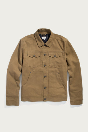 The Bridge & Burn Burl Trucker Jacket in Warm Olive is a denim-style jacket featuring two chest pockets, two side pockets, long sleeves, and a collar, shown laid flat on a light background.