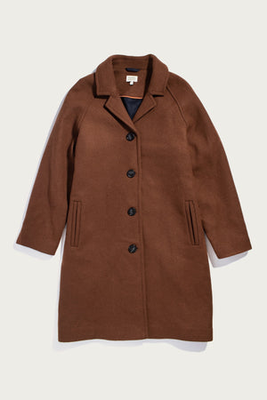 The Alberta Car Coat by Bridge & Burn in Fired Brick is a heavyweight wool coat with a notched collar, black front buttons, and two vertical slit pockets, shown on a white background.
