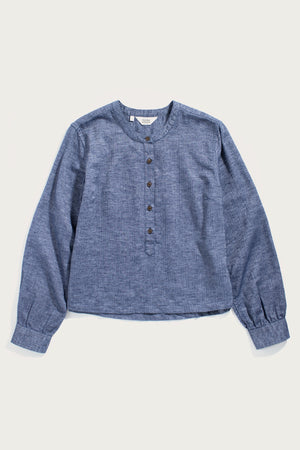 The Bridge & Burn Yarra Pullover in Indigo Herringbone is a sustainable, long-sleeved top with a round neck, button placket, and cuffed sleeves, shown laid flat on a white background.