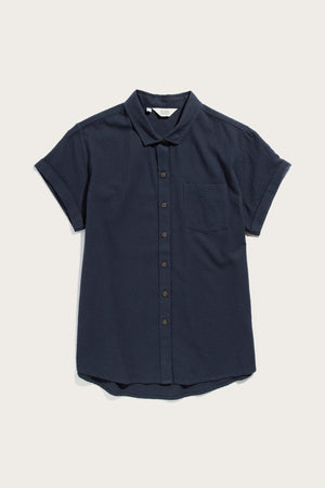 The Bridge & Burn Bea Shirt in navy seersucker is a short-sleeved, tailored-fit shirt with a collar and single chest pocket, shown against a plain light background.