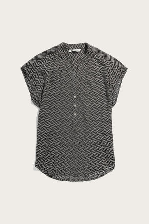 The Ladd Shirt by Bridge & Burn is a short-sleeve pullover blouse featuring a black and white geometric zigzag pattern, button-down front, and collar, shown laid flat on a light background.