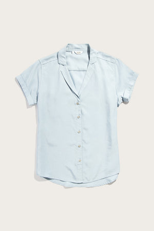 The Bridge & Burn Innes Shirt in Sky Blue features a relaxed fit, short sleeves, and a notched collar, crafted from lightweight Tencel linen fabric, shown laid flat on a white background.