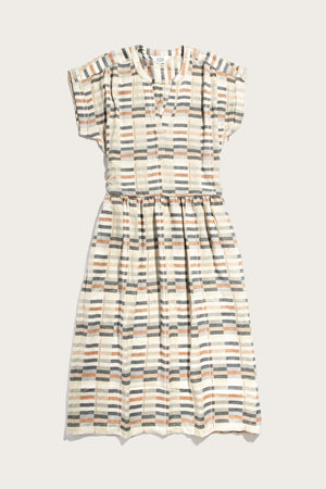 The Ira Dress / Broadway Stripe by Bridge & Burn is a short-sleeved, knee-length viscose dress featuring a gathered waist and striped geometric pattern in beige, navy, gray, and light orange on off-white. Wrinkle-resistant for easy wear.