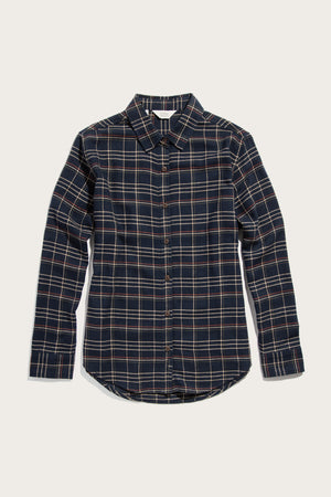 The Bridge & Burn Olivia Slim Shirt in Dusk Herringbone Plaid is a slim fit, long sleeve button-up crafted from recycled cotton, featuring a classic collar and dark navy blue and cream plaid pattern.
