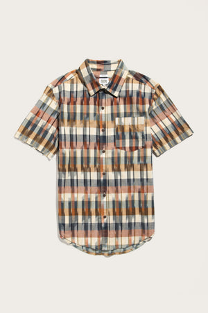 The Bridge & Burn Harbor Slim Shirt in Aurora Space Dye Plaid is a cotton short-sleeve button-up with a collar, single chest pocket, and an orange, tan, blue, and black plaid pattern, displayed on a white background.