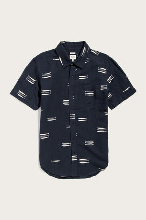 The Harbor Slim Shirt by Bridge & Burn is a short-sleeve, button-up navy top featuring a collar, chest pocket, and Pacific Herring pattern on a linen-cotton blend.