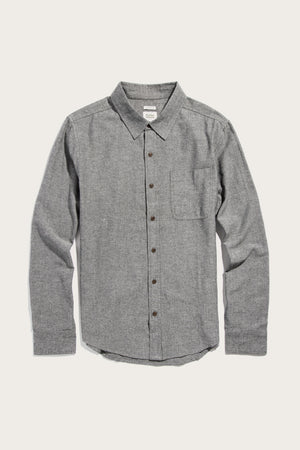 The Bridge & Burn Larson Shirt in Iron Chambray is a men's classic-fit, long-sleeve button-up made from gray recycled cotton with a single chest pocket, shown on a plain white background.