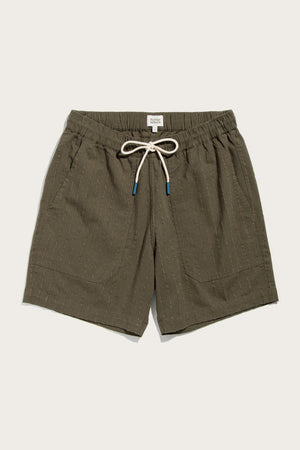 The Bridge & Burn Noah Short in Olive Stripe features a cotton-linen blend, vertical pinstripes, elastic waist with a white adjustable cord (blue tips), two front pockets, and a relaxed pull-on fit, shown flat on a light background.