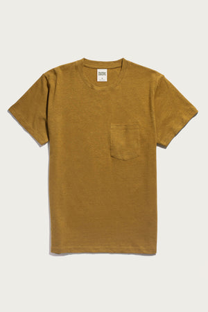 The Bridge & Burn Organic Hemp Pocket Tee in Ochre is a sustainable, short-sleeve t-shirt featuring a round neckline and small chest pocket, shown in mustard yellow on a white background.
