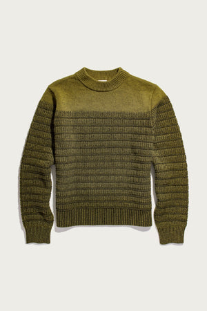 The Bridge & Burn Sabine Sweater in olive features long sleeves, merino wool, a textured horizontal stripe pattern, and a crew neck—making it a cozy layering piece. Sweater is laid flat on a light background.
