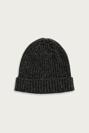 The Bridge & Burn Chunky Ribbed Beanie in Black Donegal is displayed on a plain light background, featuring a folded brim for warmth and style.
