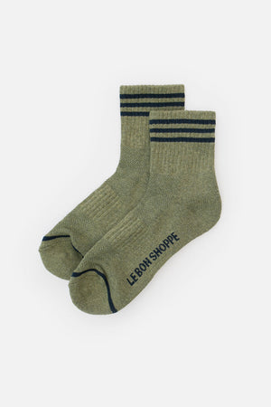 A pair of Le Bon Shoppe Girlfriend Socks in Sage, featuring two dark green stripes at the top and "LE BON SHOPPE" text on the sole, displayed on a white background.