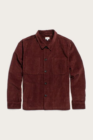 The Bridge & Burn Banks Shirt Jacket in Redwood Corduroy is a long-sleeve, button-up jacket with two chest pockets and a classic collar, shown laid flat on a plain light background.