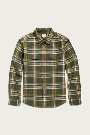 The Bridge & Burn Cole Slim Shirt in Green Mountain Plaid features soft brushed cotton, long sleeves, button-down front, classic collar, green/yellow/white/brown plaid pattern, and two chest pockets with button flaps.