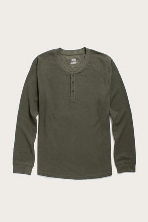 The Bridge & Burn Men's Recycled Waffle Henley in Forest Melange is a long-sleeve shirt with a round neck and three-button placket, made from recycled fibers and shown laid flat on a light background.