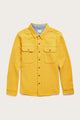 The Pointer Overshirt by Bridge & Burn in Antique Gold is a bright yellow, long-sleeve, button-up twill shirt with two chest pockets and brown buttons, crafted from recycled fibers and shown laid flat on a light background.