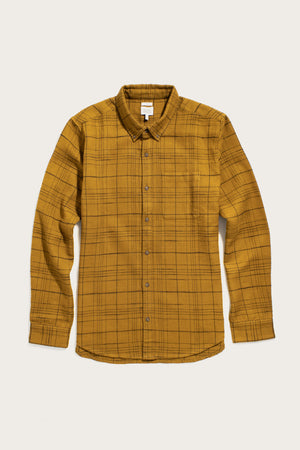 Bridge & Burn’s Sutton Slim Shirt in Golden Horizon Plaid features a mustard yellow and black plaid design, chest pocket, and collar for a minimalist look. Laid flat on a light background.