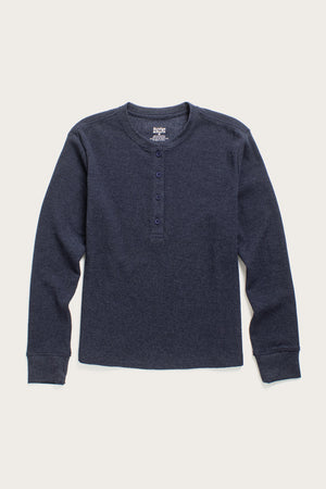 The Bridge & Burn Women's Recycled Waffle Henley in Sapphire Melange is a long-sleeve, waffle-knit shirt with a round neckline and four-button placket, shown laid flat on a white background.