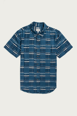 The Emerson Slim Shirt by Bridge & Burn features short sleeves, button-up front, and a blue base with white and dark blue geometric stripes, shown laid flat on a white background.