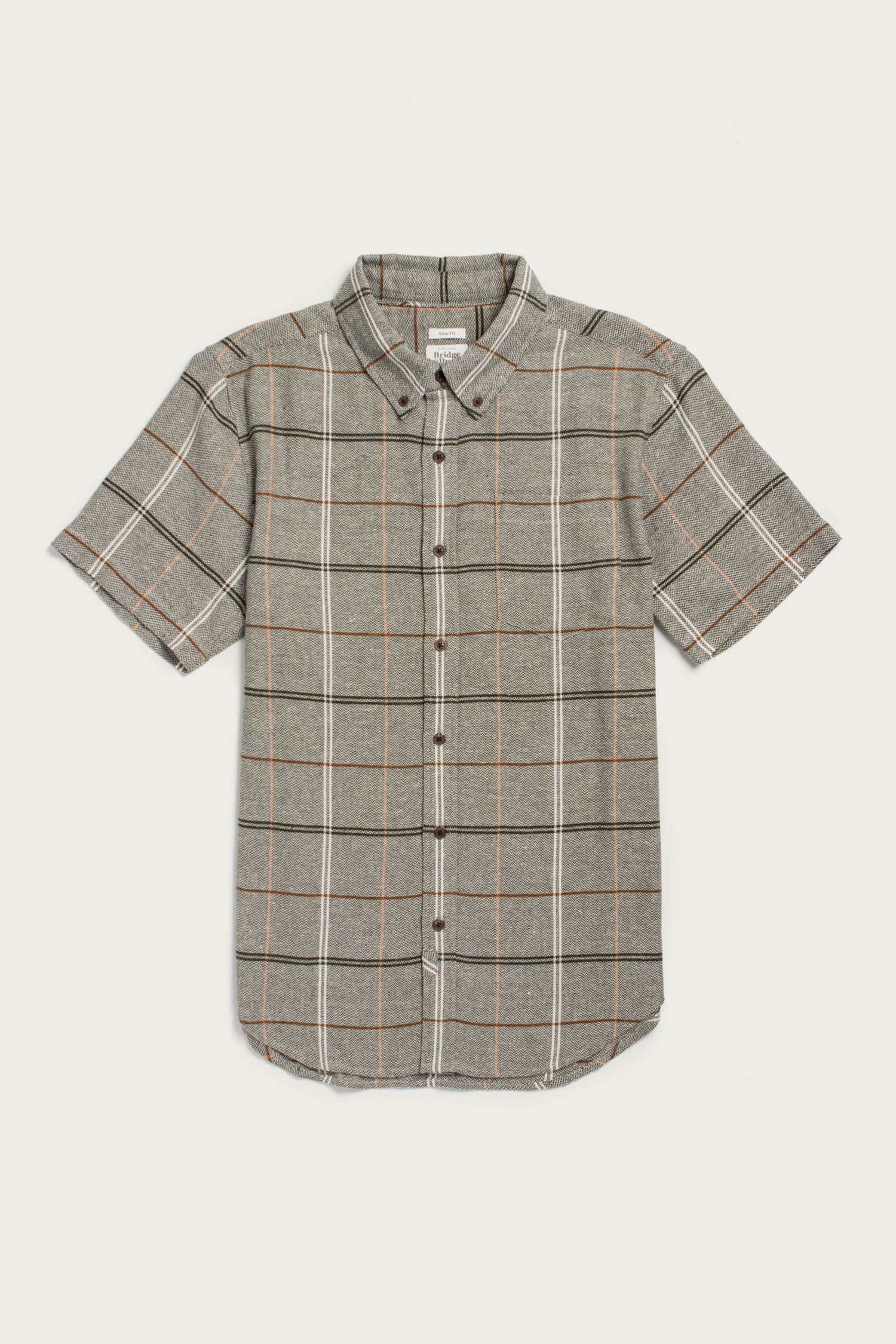 The Bridge & Burn Jordan Slim Shirt in Olive Ember Grid is a modern, short-sleeve button-up with a collar and chest pocket, featuring an olive base with white and orange plaid, crafted from recycled cotton.