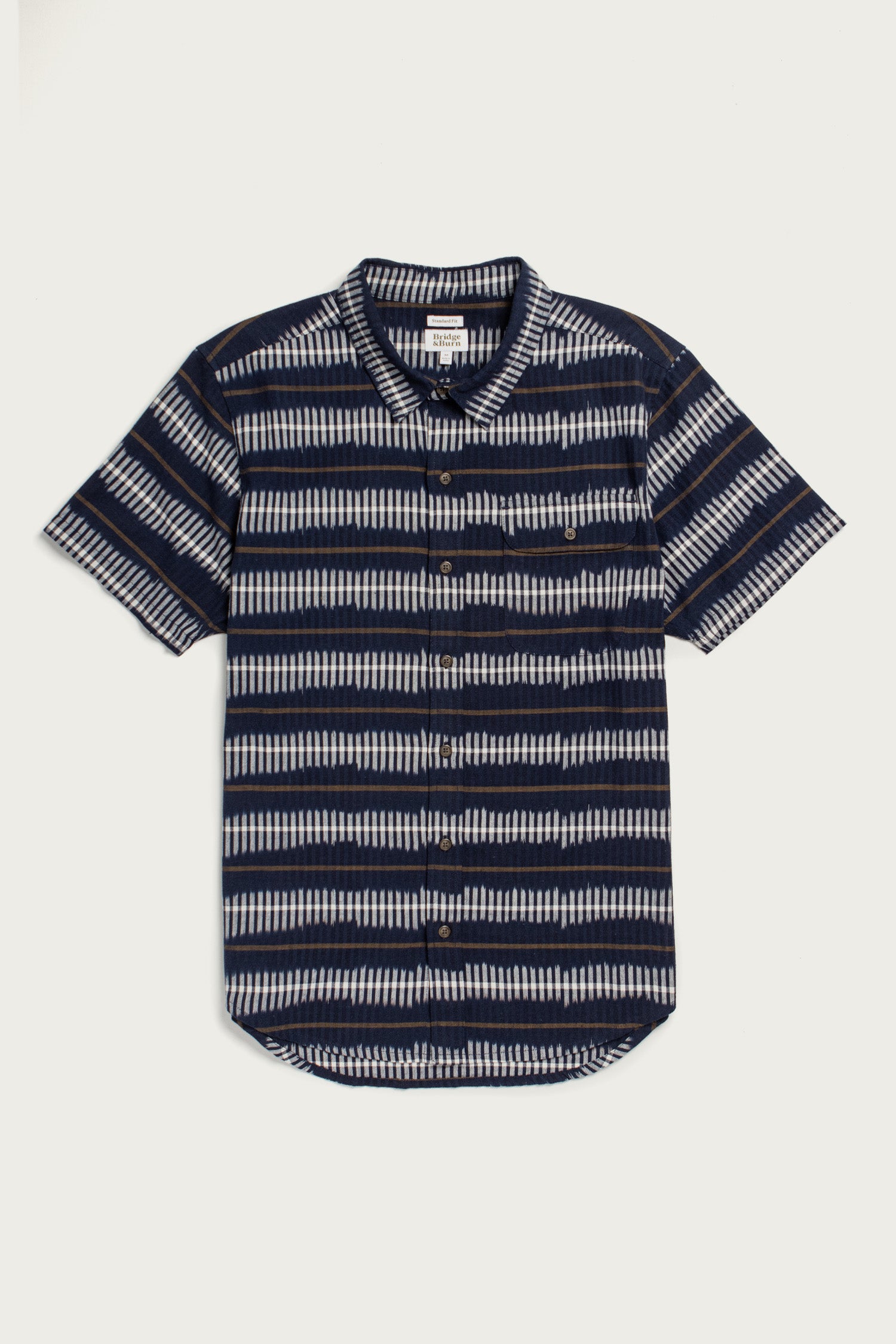The Marten Shirt in Dusk Mirage by Bridge & Burn is a cotton short-sleeve button-down with a front pocket and horizontal navy, white, and gray stripes on white—offering comfort and timeless style.