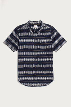 The Marten Shirt in Dusk Mirage by Bridge & Burn is a cotton short-sleeve button-down with a front pocket and horizontal navy, white, and gray stripes on white—offering comfort and timeless style.