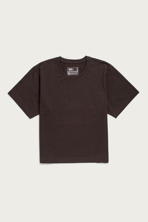 The Bridge & Burn Recycled Boxy Tee in Truffle is a sustainable, short-sleeved dark brown shirt with a round neckline and visible collar tag, shown laid flat on a light background.
