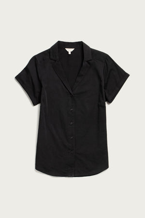 The Bridge & Burn Innes Shirt in black is a relaxed fit, short-sleeve button-up blouse with a collar, crafted from soft organic cotton and shown flat on a light background.
