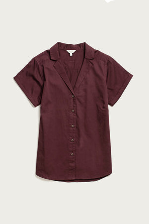 The Bridge & Burn Innes Shirt in Burgundy is a relaxed-fit, short-sleeve button-up made from soft organic cotton, featuring a notched collar and shown laid flat on a light background for styling inspiration.