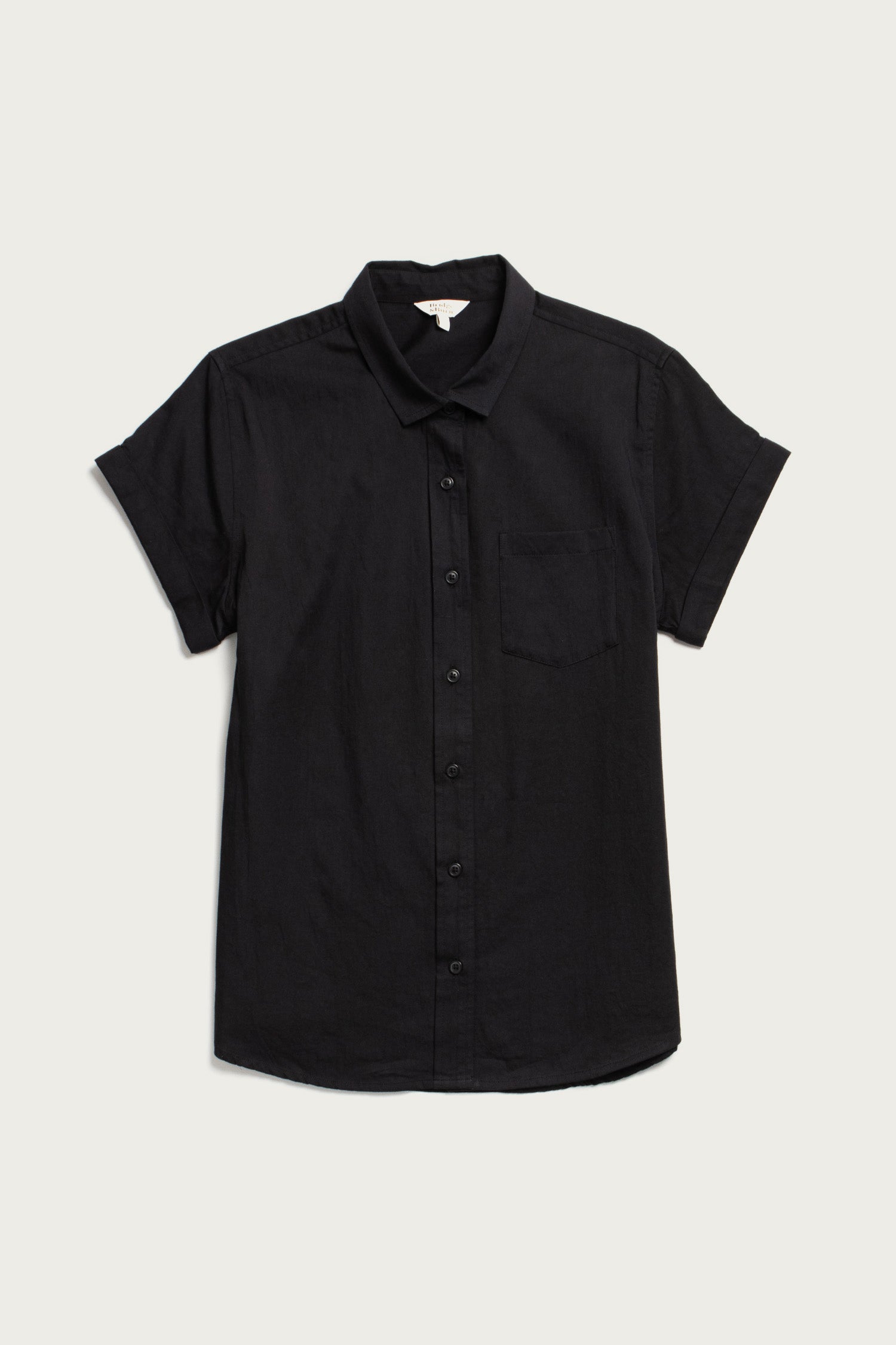The Bridge & Burn Bea Shirt in black is a classic, short-sleeve button-down with a collar and chest pocket, shown laid flat on a light background.