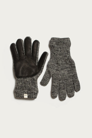 The Bridge & Burn Ragg Wool Lined Glove in Charcoal—made in the USA—features a textured black grip and small white tag on one glove, shown palm up, with the other displayed palm down on a white background.