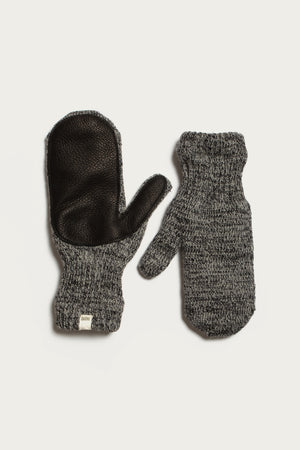 Bridge & Burn’s Ragg Wool Lined Mitten in Charcoal, made in the USA, features a black leather palm on one mitten and a knit textured back on the other, finished with ribbed cuffs for comfort.