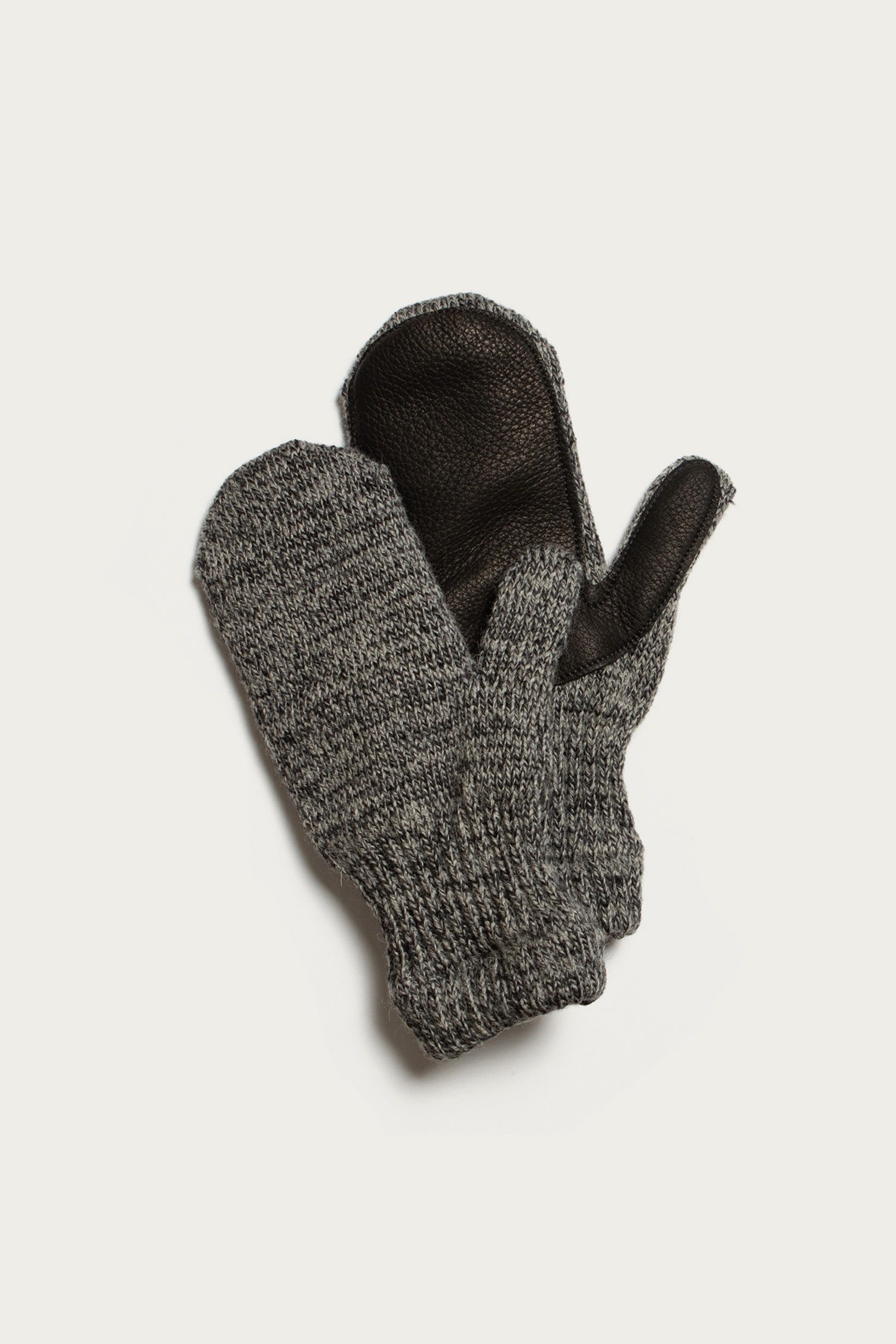 Bridge & Burn Ragg Wool Lined Mitten in Charcoal—gray wool knit mittens with black leather palms, made in the USA. One mitten is stacked atop the other on a plain white background.