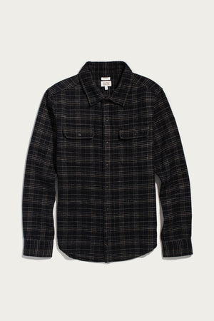 Bridge & Burn Cole Slim Shirt in Obsidian Grid, a slim-fit long-sleeve black flannel featuring a tan grid pattern, two chest pockets, and a button-down front.