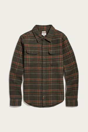 Bridge & Burn Cole Slim Shirt in Timberline Plaid: a slim-fit, long-sleeved button-down shirt in a dark green, orange, and yellow plaid pattern with two button-flap chest pockets.