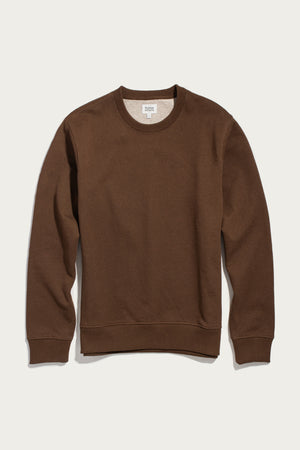 A Hayden Crew Sweatshirt in Cumin by Bridge & Burn, made from recycled cotton with long sleeves, is laid flat on a white background.