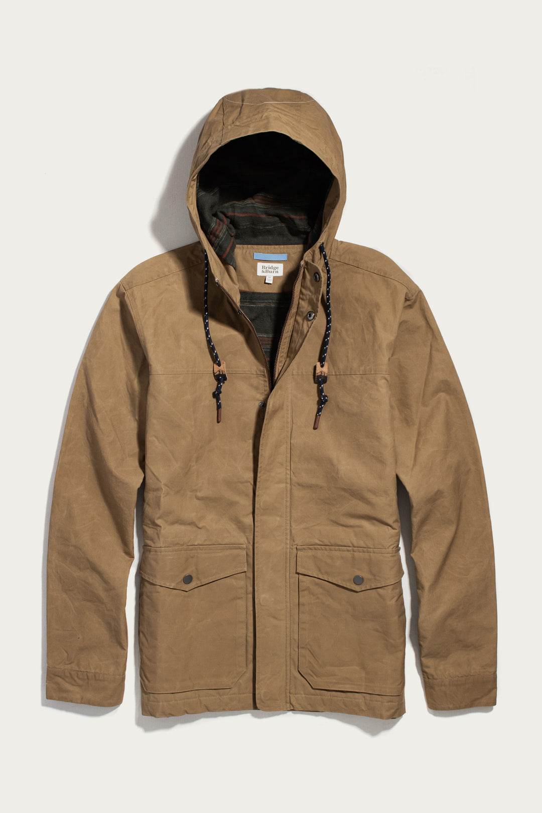 Bridge & Burn Marshall Jacket in dark khaki, a water-resistant hooded style with a front zipper, snap-button flap pockets, and patterned interior lining.
