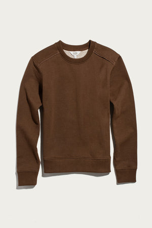 The Bailey Crew Sweatshirt in Cumin by Bridge & Burn is laid flat on a white background. This sustainable crewneck long-sleeve sweatshirt features ribbed cuffs, hem, and neckline, with visible stitching along the shoulders and sides.