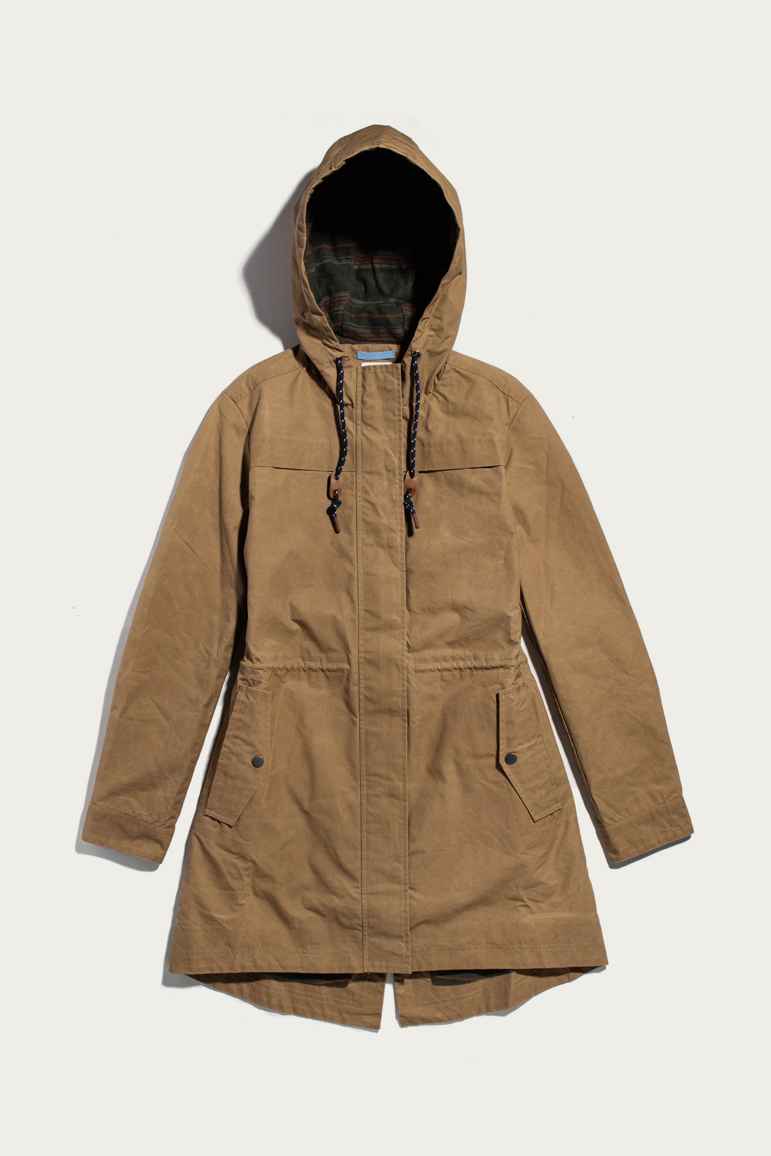 Bridge & Burn Briar Jacket / Dark Khaki Waxed Canvas: a khaki British Millerain waxed cotton hooded parka with a drawstring waist, snap-flap pockets, and a dark plaid lining.