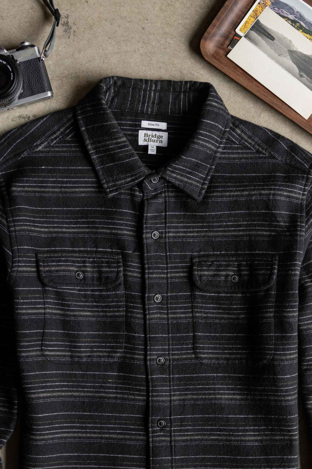 Bridge & Burn Cole Slim Shirt in Raven Stripe: a black slim-fit button-down in brushed cotton with thin horizontal stripes and two chest pockets.
