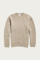 The Bridge & Burn Ludlow Sweater in Flecked Oatmeal is a beige, long-sleeve cable-knit top made from RWS-certified wool, featuring a crew neckline with ribbed cuffs and hem, shown on a white background.