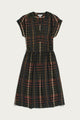 The Bridge & Burn Ira Dress in Olive Stripe is a short-sleeve, knee-length pullover dress with a dark multicolored striped pattern, featuring a gathered waist and split neckline. Crafted from a soft modal-linen blend, it is shown laid flat on a white background.