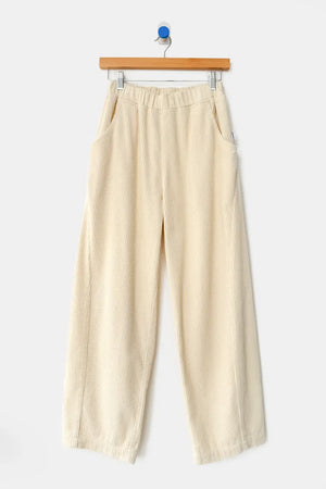 Le Bon Shoppe - Soft Corduroy Arc Pant / Ecru in off-white, featuring a high-waist, cropped wide-leg cut, elastic waistband, and side pockets, hanging on a wooden hanger.