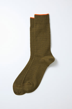 RoToTo Cotton Thermal Socks in olive green, featuring a subtle textured pattern and a thin orange trim at the top, laid flat on a white background. Brand: RoToTo.