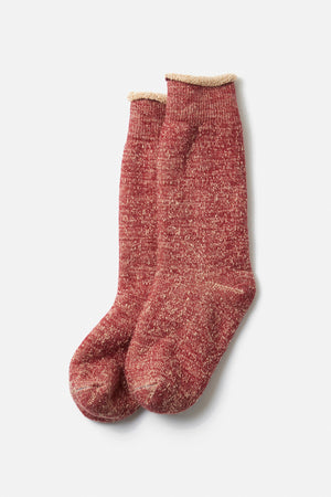 A pair of RoToTo Double Face Crew Socks in Dark Red Brown with a ribbed cuff, made in Japan by RoToTo, is laid flat on a white background.