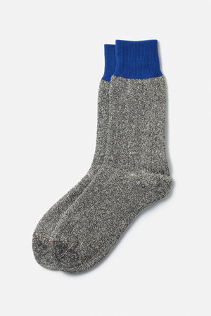 A pair of RoToTo Double Face Silk Cotton Crew Socks in Blue Grey by RoToTo, featuring thick gray fabric and bright blue ribbed cuffs, laid flat on a white background.