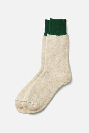 A pair of RoToTo Double Face Silk Cotton Crew Socks in Green Medium Beige by RoToTo, featuring thick, handcrafted construction and dark green ribbed cuffs, shown side by side on a plain white background.